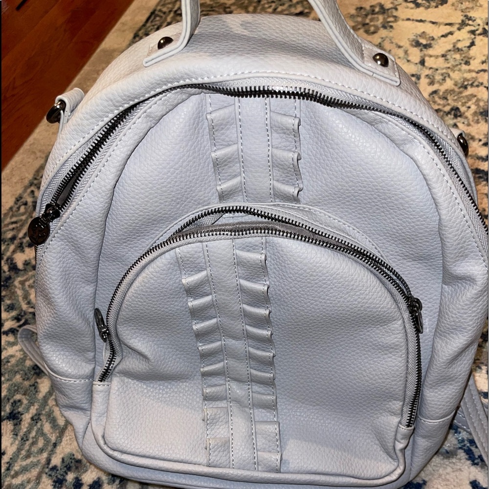 Damsel in defense back pack purse.NWOT!